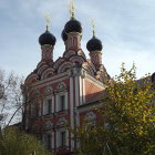 Colorful church illustration with golden domes in nature setting