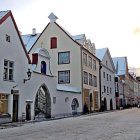 Vibrant winter city street with snow-covered buildings and pedestrians