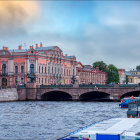 Cityscape painting at dusk with bridge, boats, historic buildings, and colorful sky.