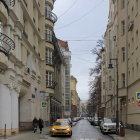 European Alley Scene: Cobblestone Street, Pastel Buildings, Balcony Plants