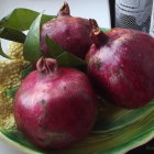 Colorful Fruit Still Life with Pitcher and Leaves