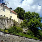 Stone Stairway with Colorful Flowers Leading to Sunlit House