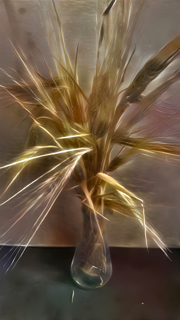 A lighted bouquet of wheat branches