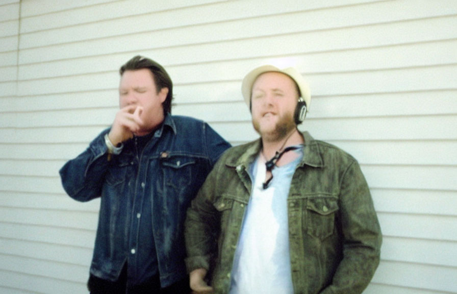 Blurred photo of two men in casual jackets