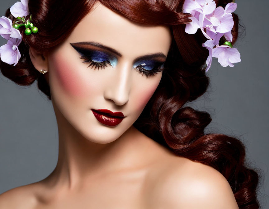 Woman with Vibrant Makeup and Styled Auburn Hair with Purple Flowers