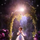 Golden Gown Woman in Magical Archway with Purple Roses and Stars