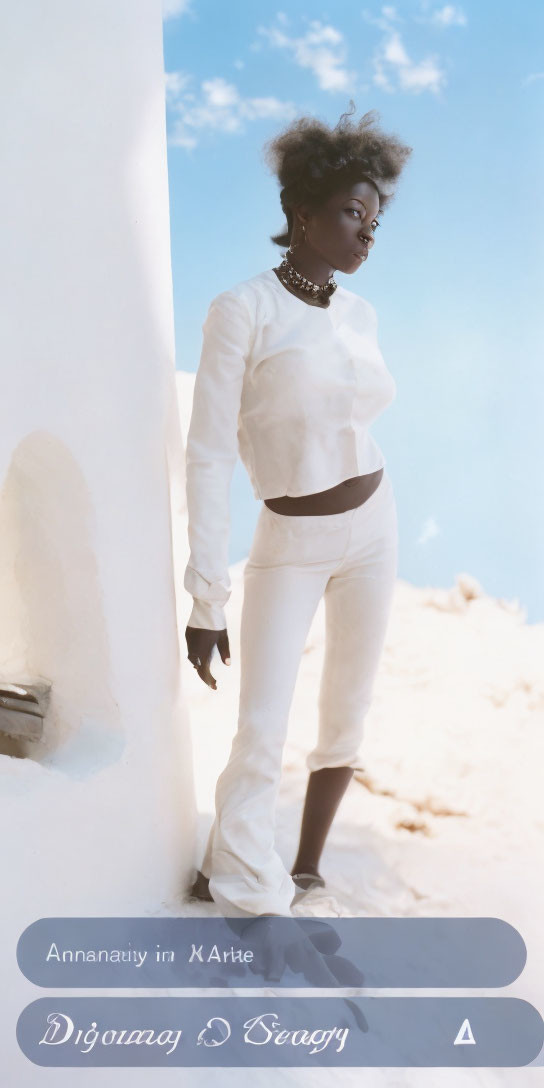 Confident woman in white outfit against blue sky and structure