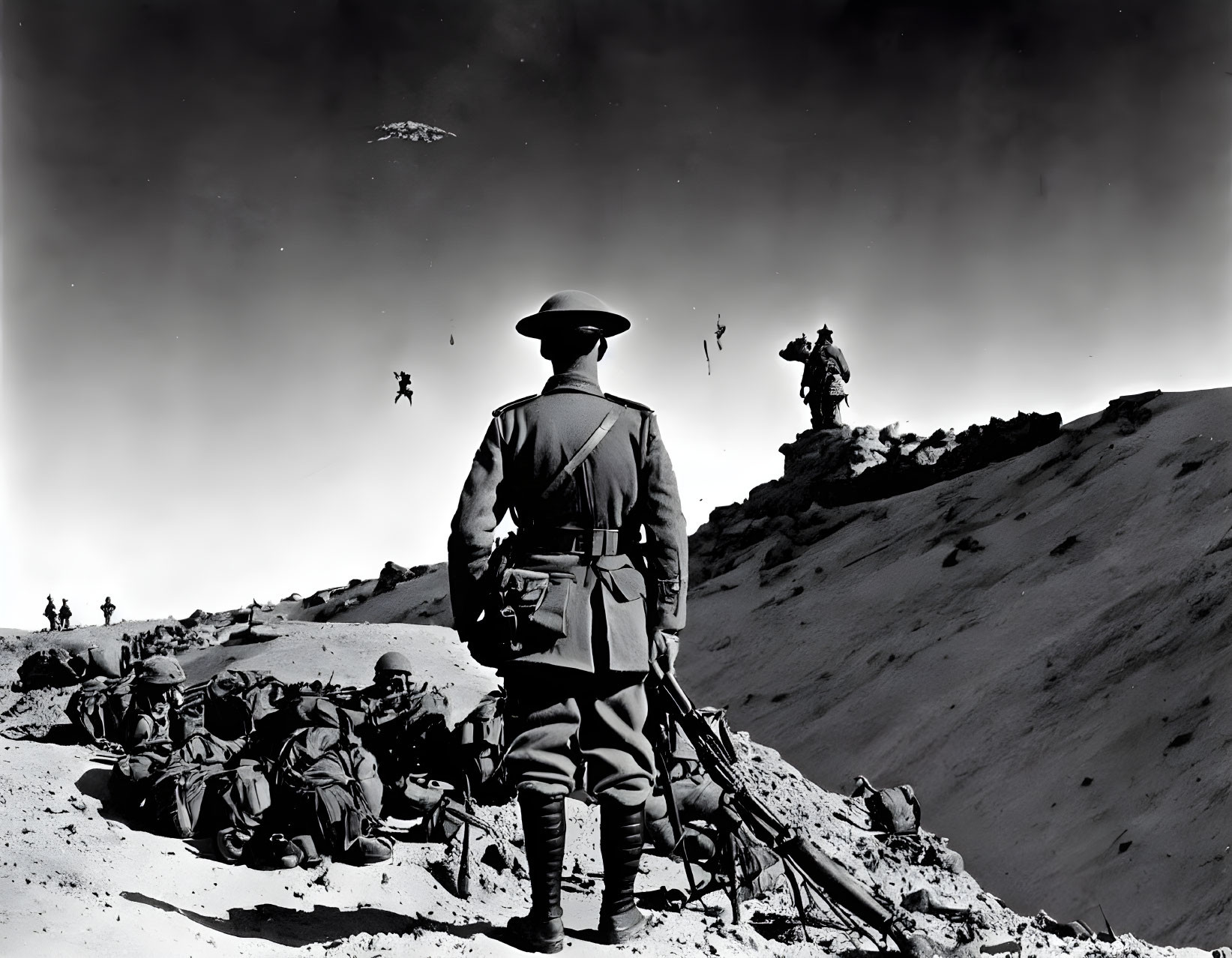 Military soldiers in barren landscape under dramatic sky