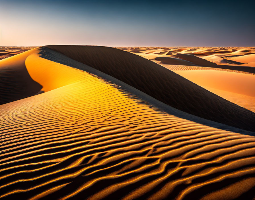 Sunset desert sand dunes with rippled textures: shadows and highlights