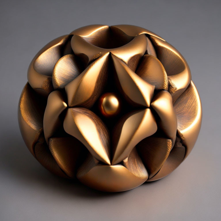 Bronze-colored spherical sculpture with intricate floral pattern