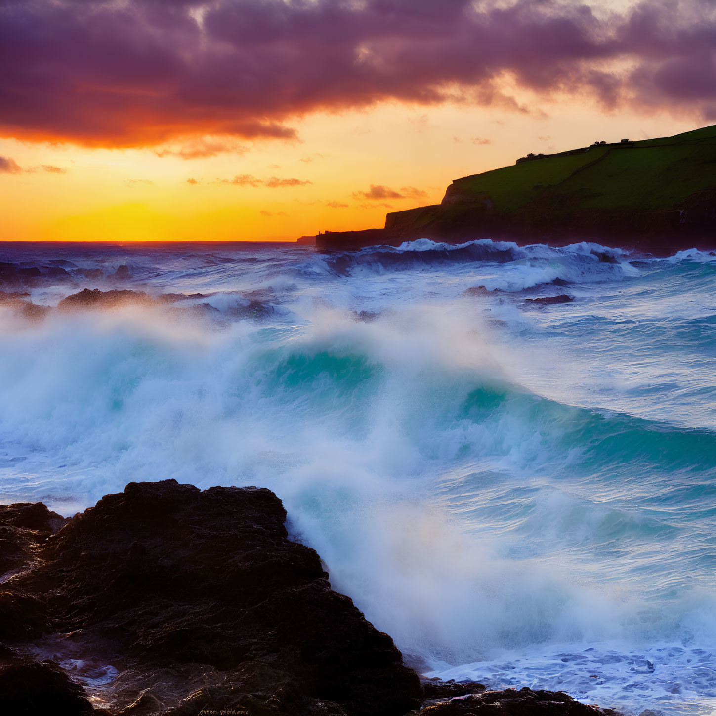 Fiery Sunset Over Rough Sea and Serene Headland