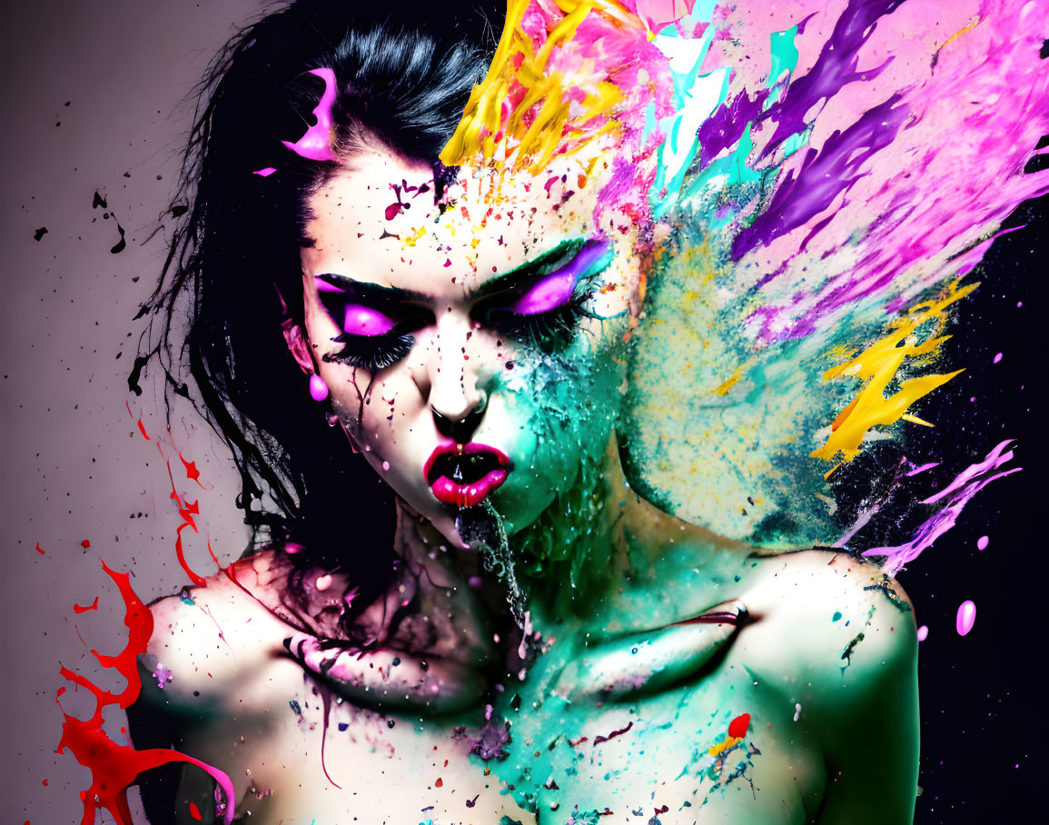 Woman with dramatic makeup splashed with vibrant paint