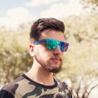 Colorful Mohawk Hairstyle Man in Sunglasses Under Cloudy Sky