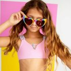 Colorful Woman with Wavy Hair Adjusting Sunglasses on Playful Background