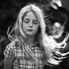 Young girl with vibrant hair against black and white background