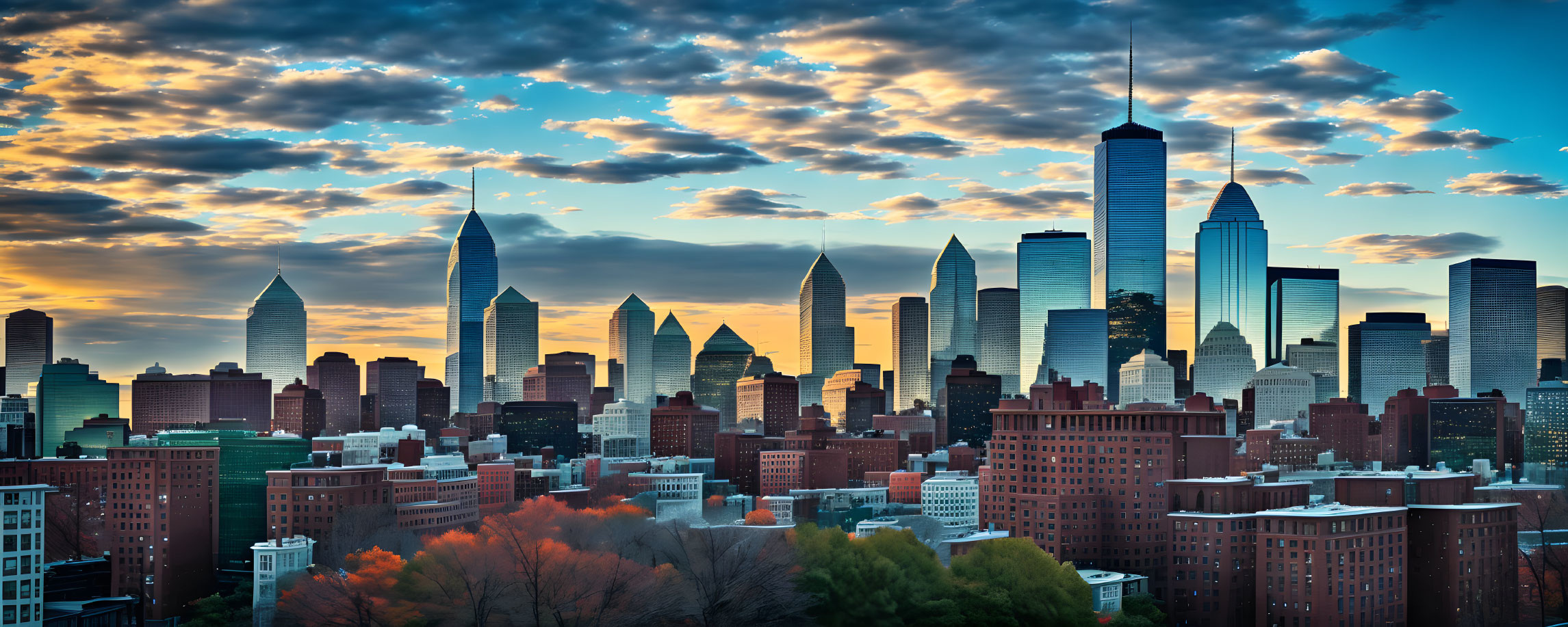 City skyline with skyscrapers under dramatic sunset sky