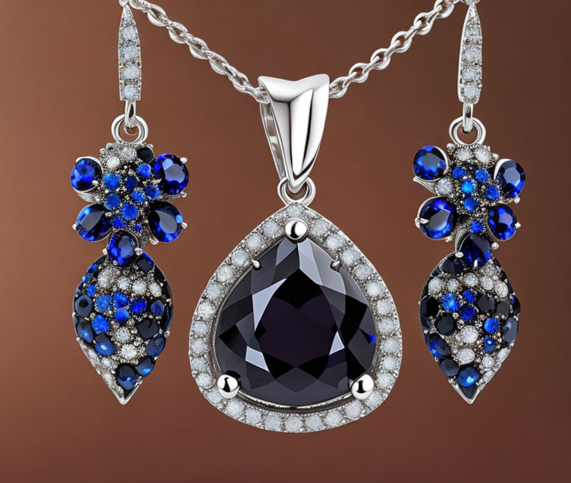 Luxurious Jewelry Set: Black Gem Pendant, Blue & Clear Crystal Earrings