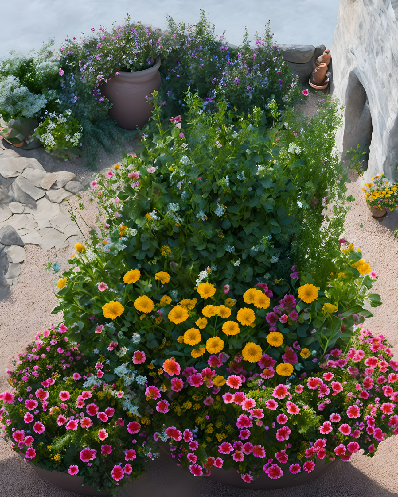 Colorful Flower Garden Next to White Stucco Wall