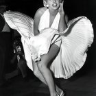 Vintage black and white photo of woman in elegant white dress