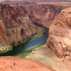 Scenic river flowing through deep sandstone canyon