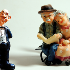 Elderly Trio in Classic Attire by Park Bench