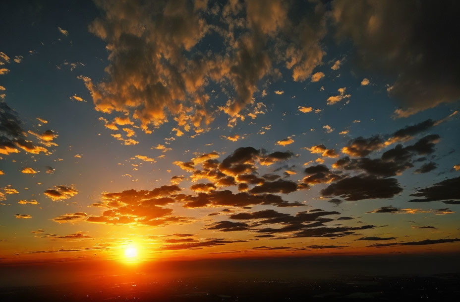 Tranquil sunset scene with radiant sun and golden-edged clouds