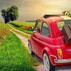 Vintage Red Car with Flowers in Poppy Field on Dirt Road