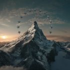 Golden sunrise over snow-capped mountains and misty peaks