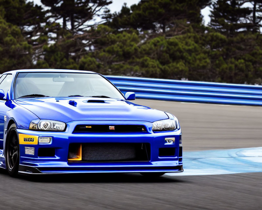 Blue sports car on racetrack with blurred background depicts high speed