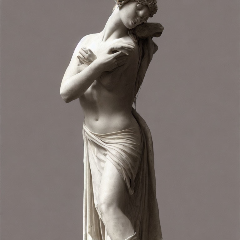 Marble statue of draped woman in reflective pose