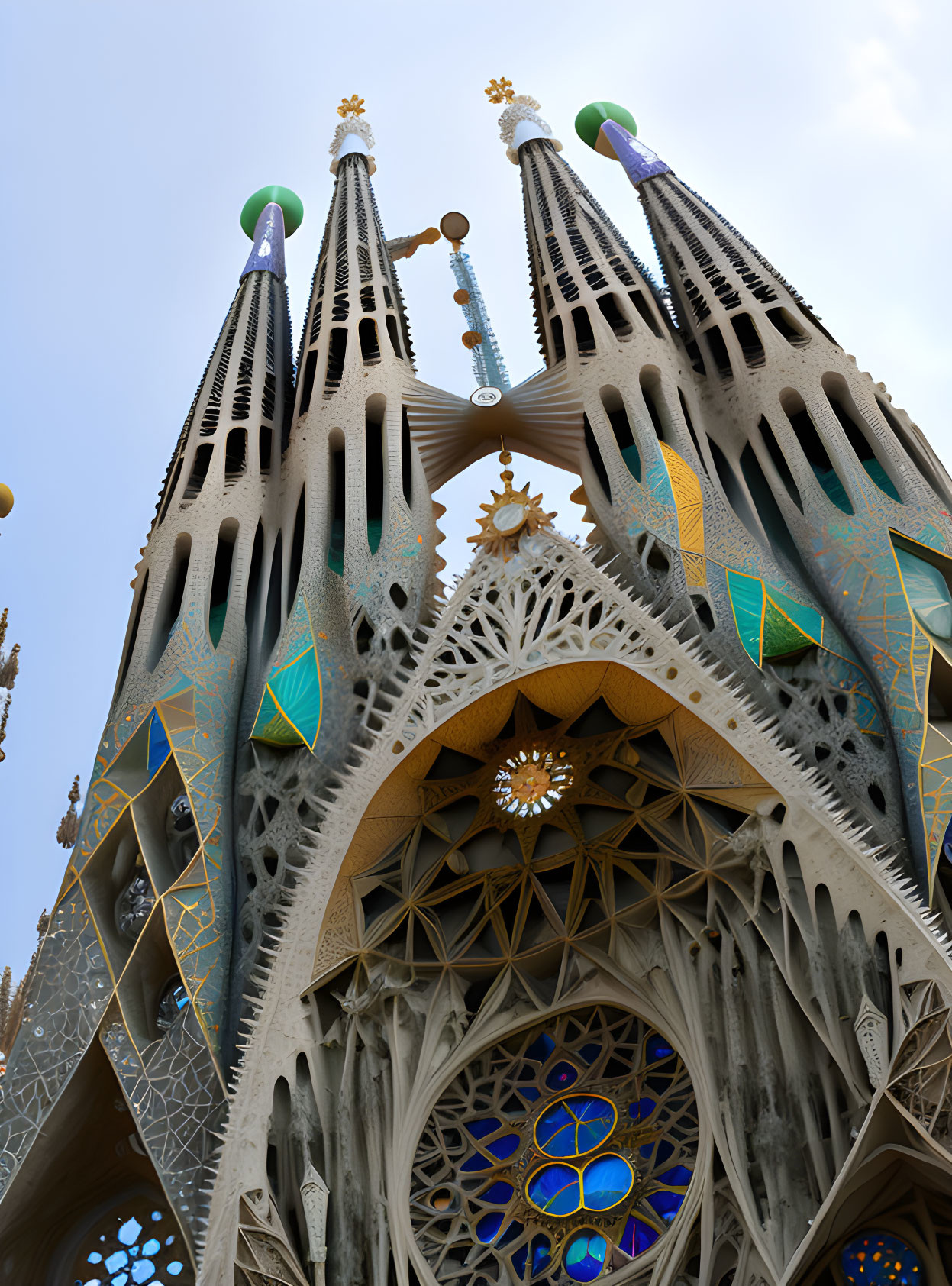 Intricate stone work and blue stained-glass windows of Sagrada Familia.