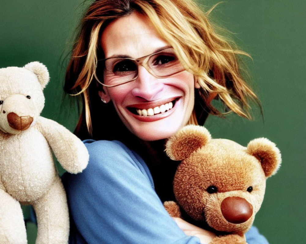 Blonde woman with glasses hugging teddy bears on green background