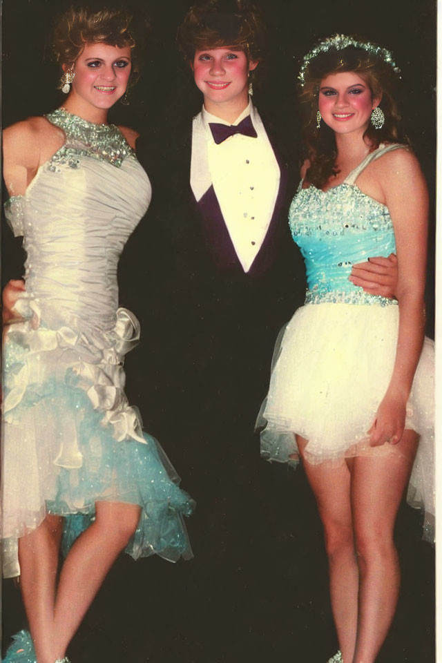 Vintage Prom Attire Trio Smiling at Formal Event