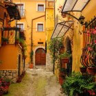 Vibrant flowering plants and traditional yellow buildings by cascading water stairs