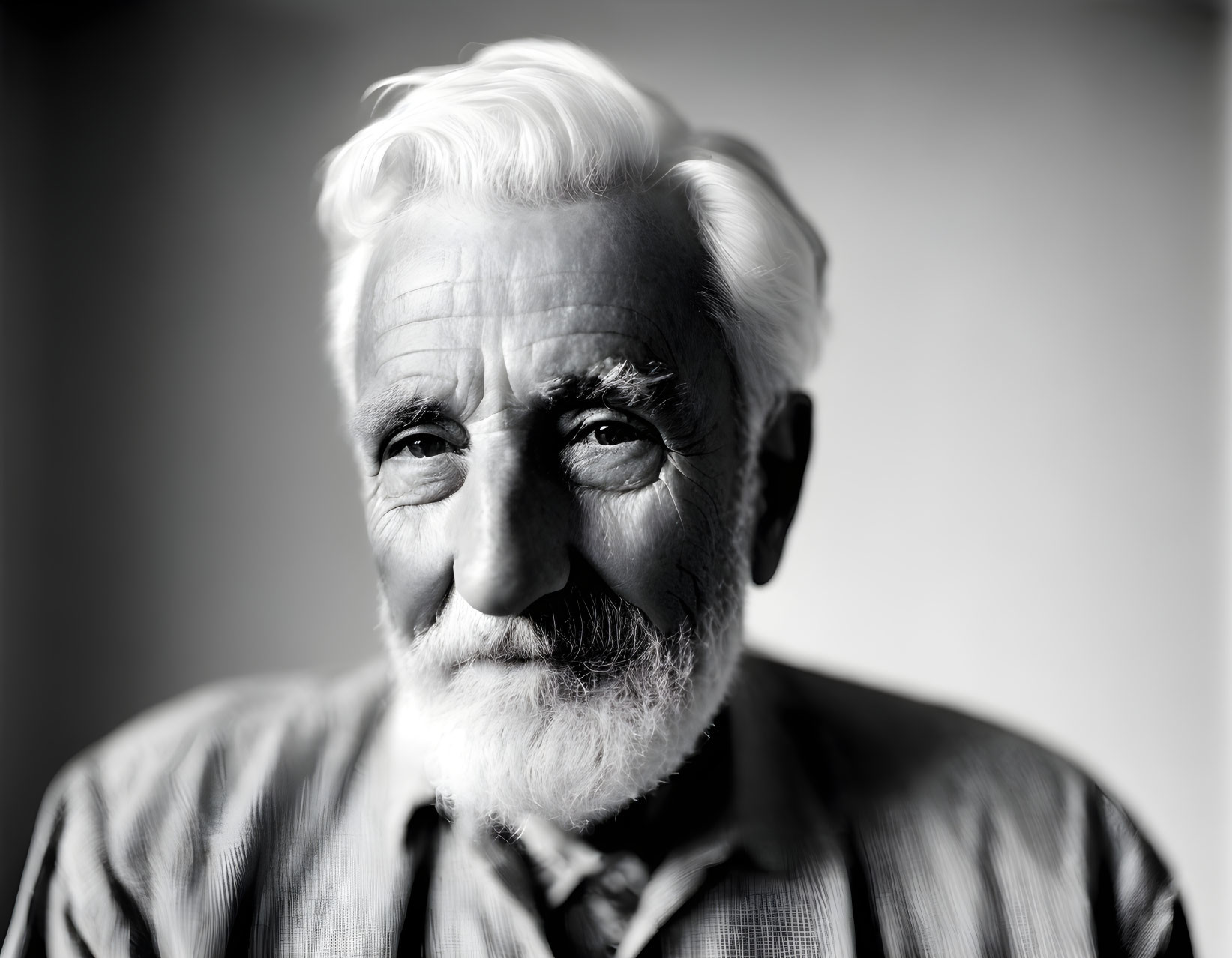 Elderly man portrait with white beard and mustache.