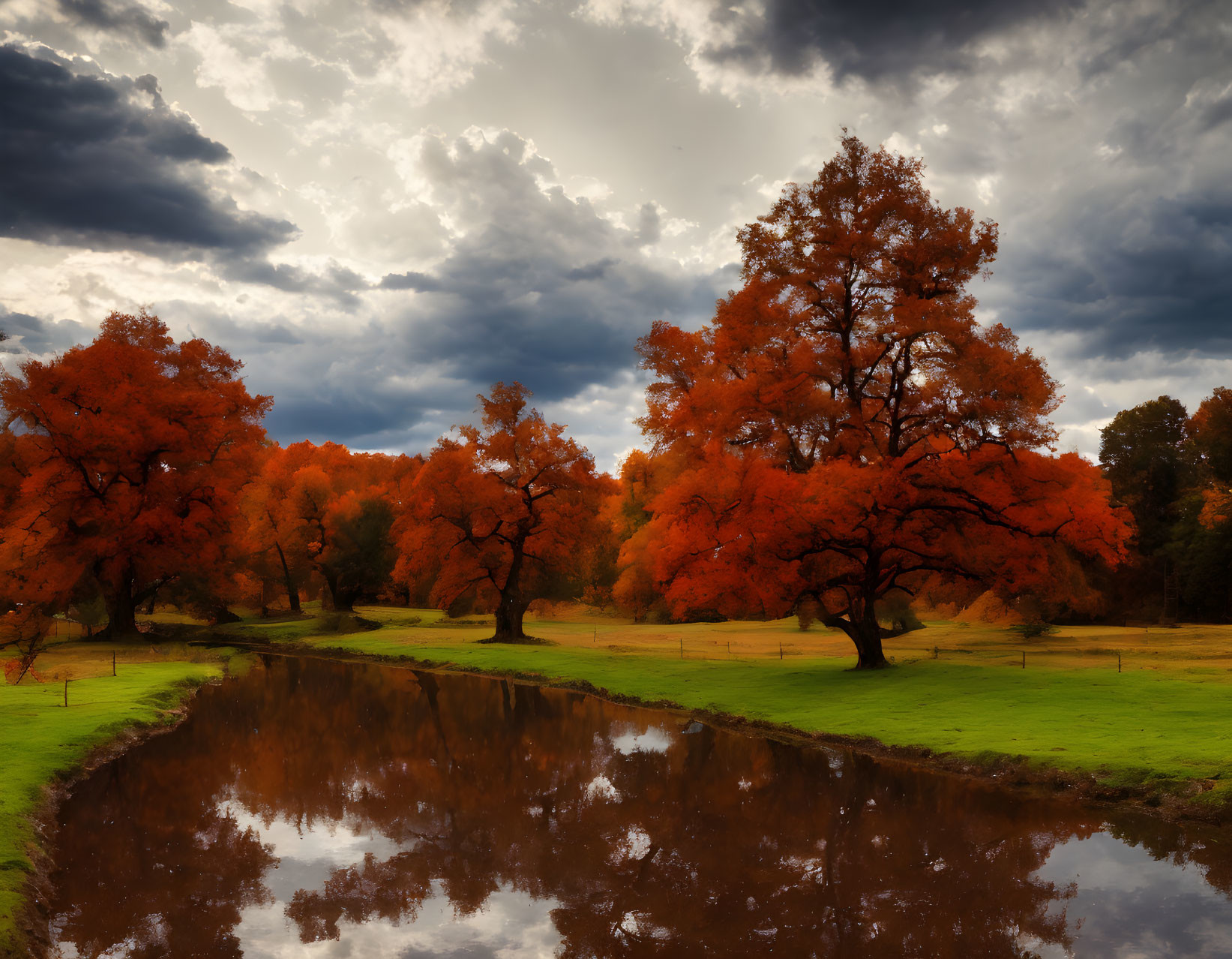 Scenic autumn landscape: vibrant red trees, reflective river, moody sky