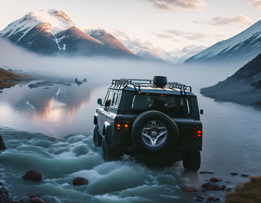 Four-Wheel-Drive Vehicle Crossing Shallow River with Snow-Capped Mountains at Sunset