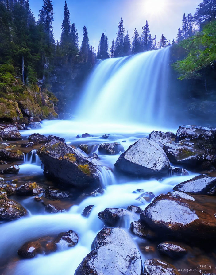 Tranquil waterfall over rocky ledge in lush forest