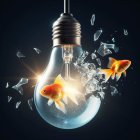 Goldfish swimming in water-filled lightbulb with splashing water on dark background