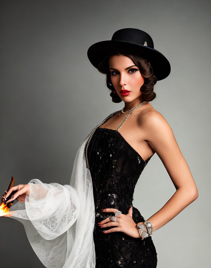 Elegant woman in black dress and hat with vintage makeup and accessories