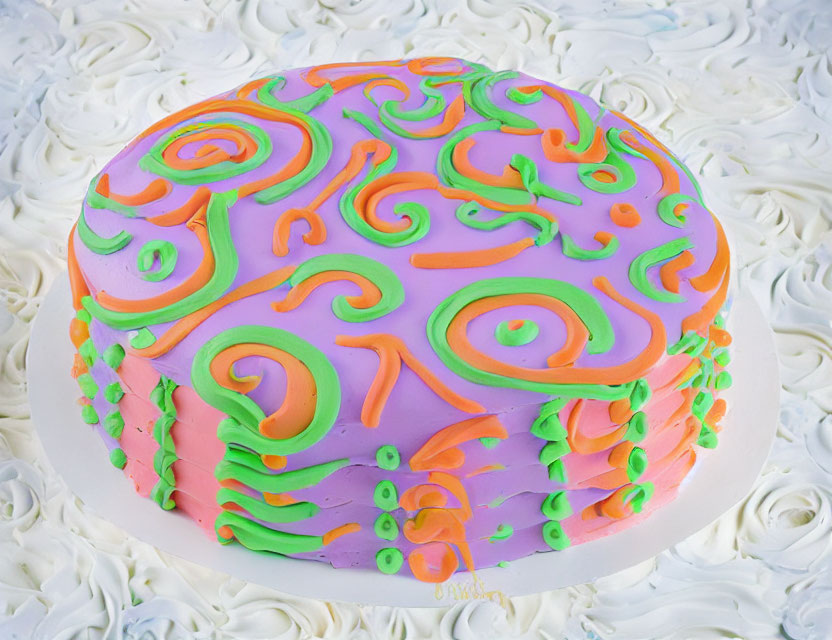 Colorful Cake with White Icing and Vibrant Fondant Swirls