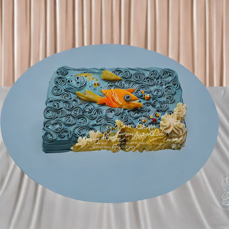 Blue Wave Design Novelty Cake with 3D Orange Fish on Pink Backdrop