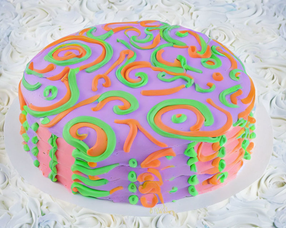 Colorful Cake with White Icing and Vibrant Fondant Swirls