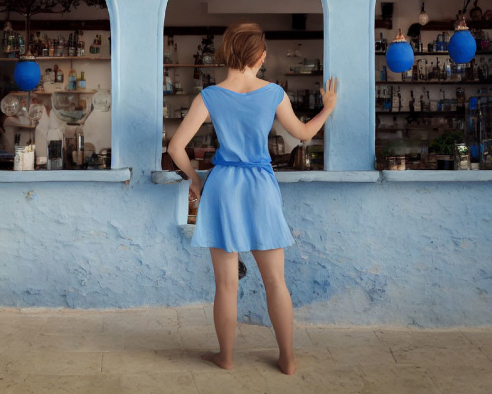 Woman in Blue Dress at Bar Counter with Blue Decor