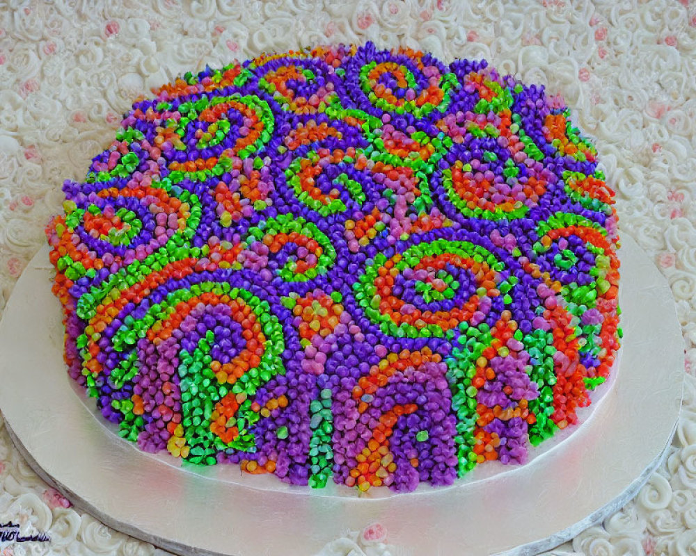 Colorful Cake with Swirled Sprinkles on White Lacy Background