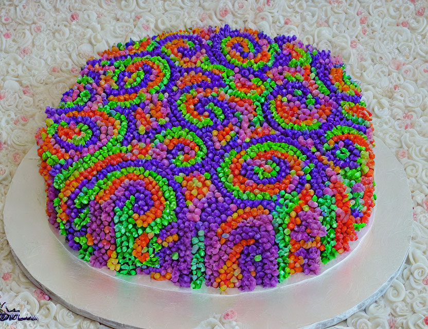 Colorful Cake with Swirled Sprinkles on White Lacy Background