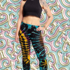 Woman in Black Crop Top and Floral Leggings Against 3D Floral Backdrop