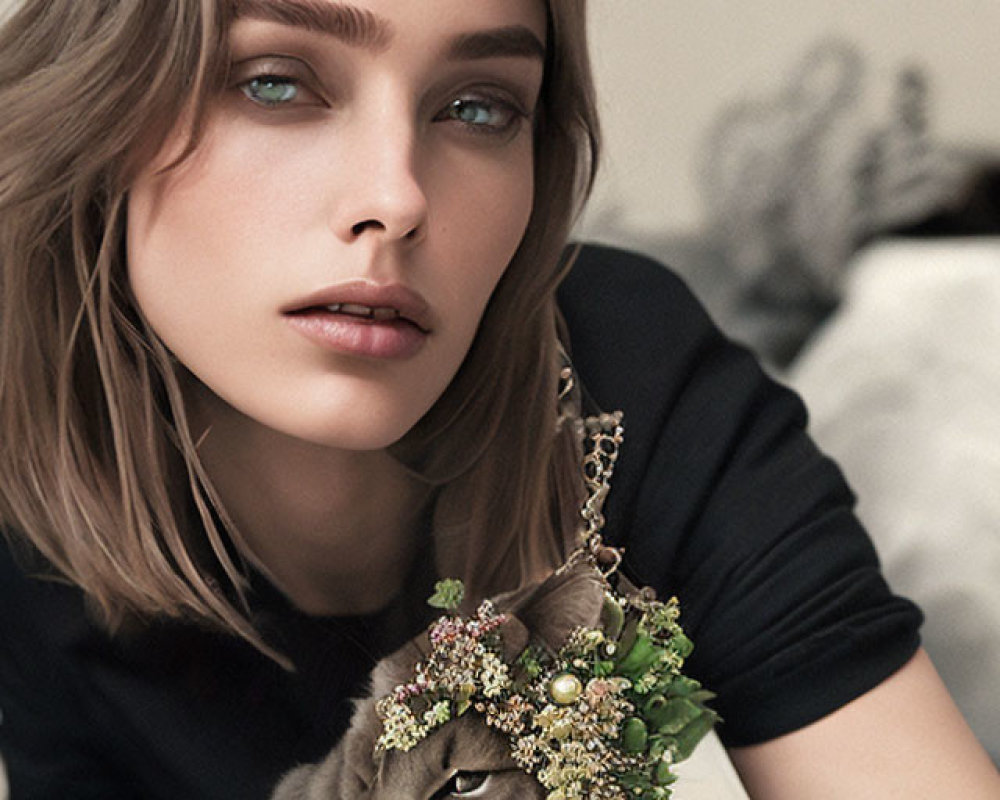 Woman with Blue Eyes and Brown Hair Poses with Cat in Floral Accessories