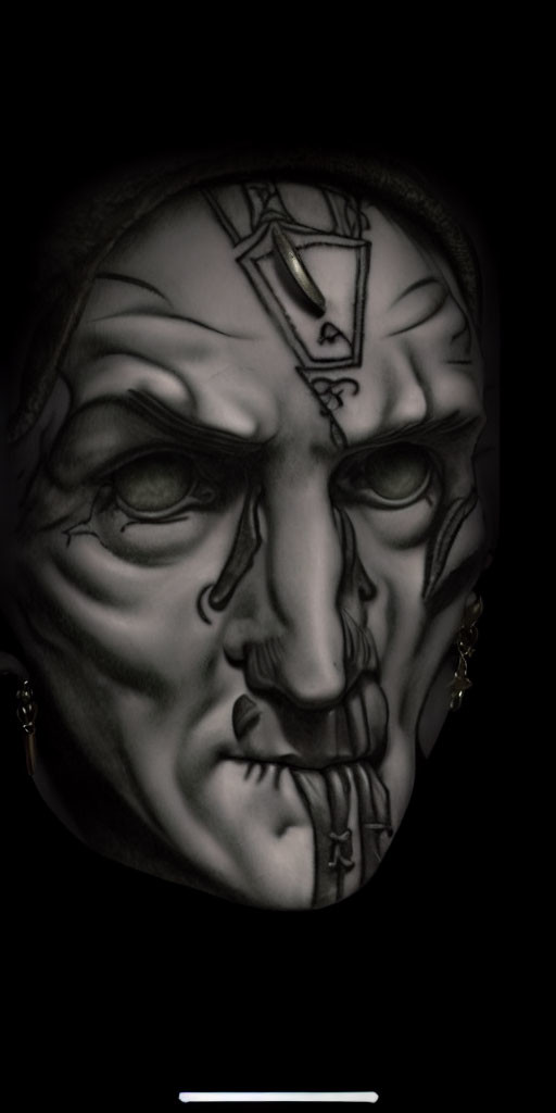 Detailed tribal mask with dramatic features on black background