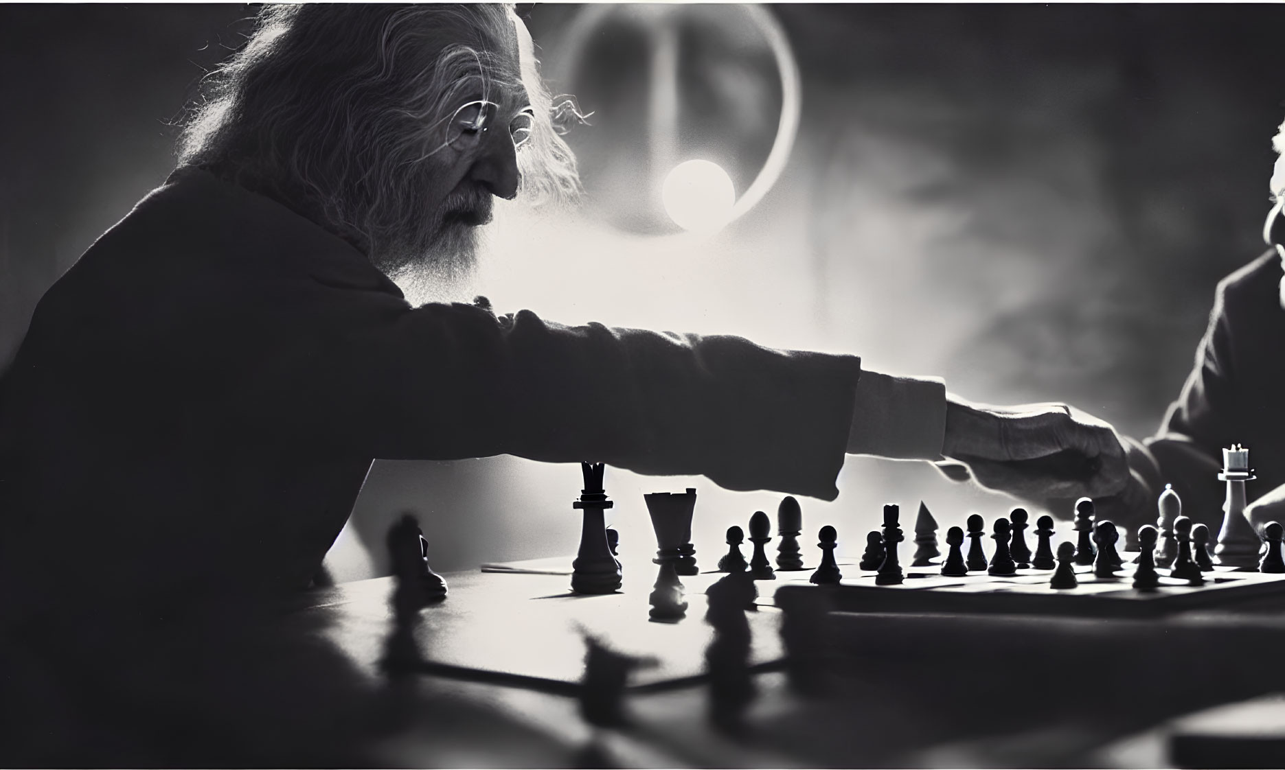 Elderly man playing chess in soft light against dark background